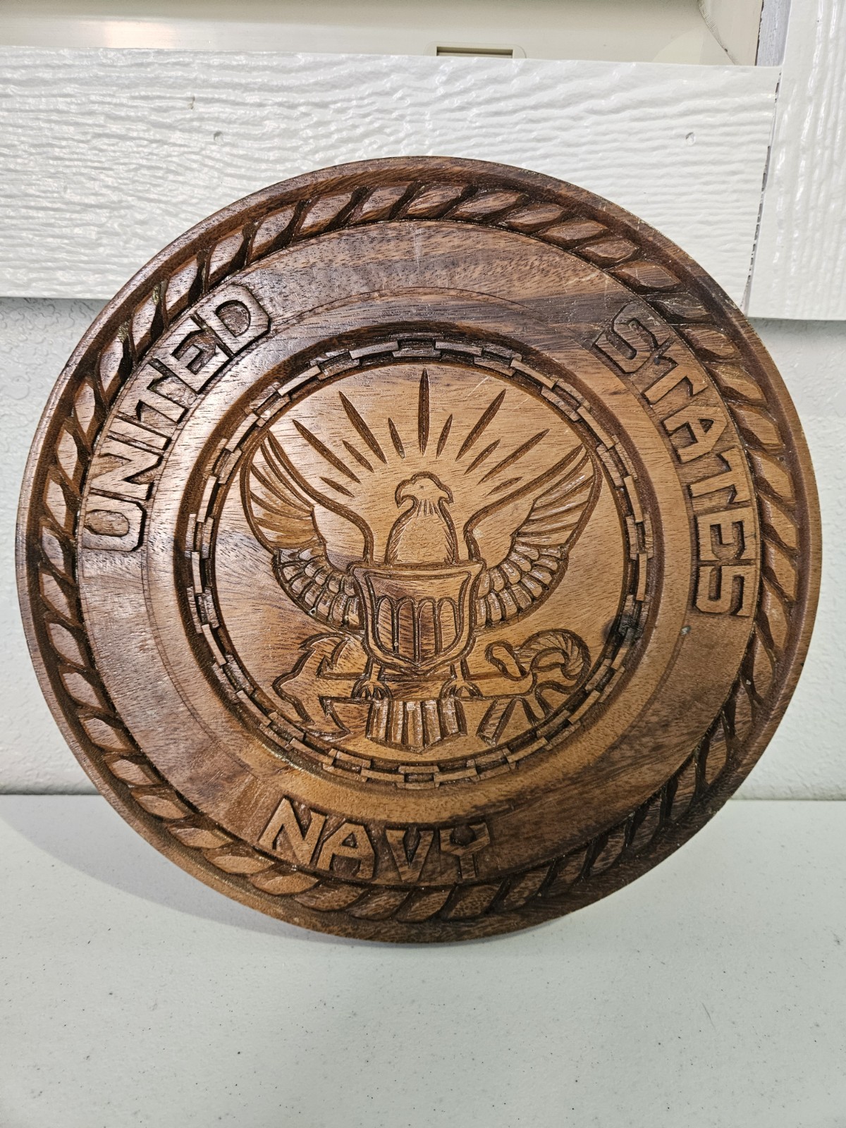 wooden plaque featuring the United States Navy 12′