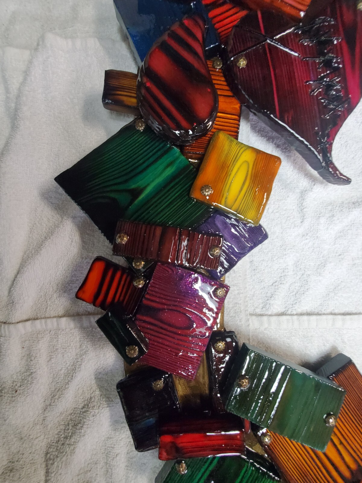 One-of-a-kind, handmade, colorful wooden wall art with mirror.