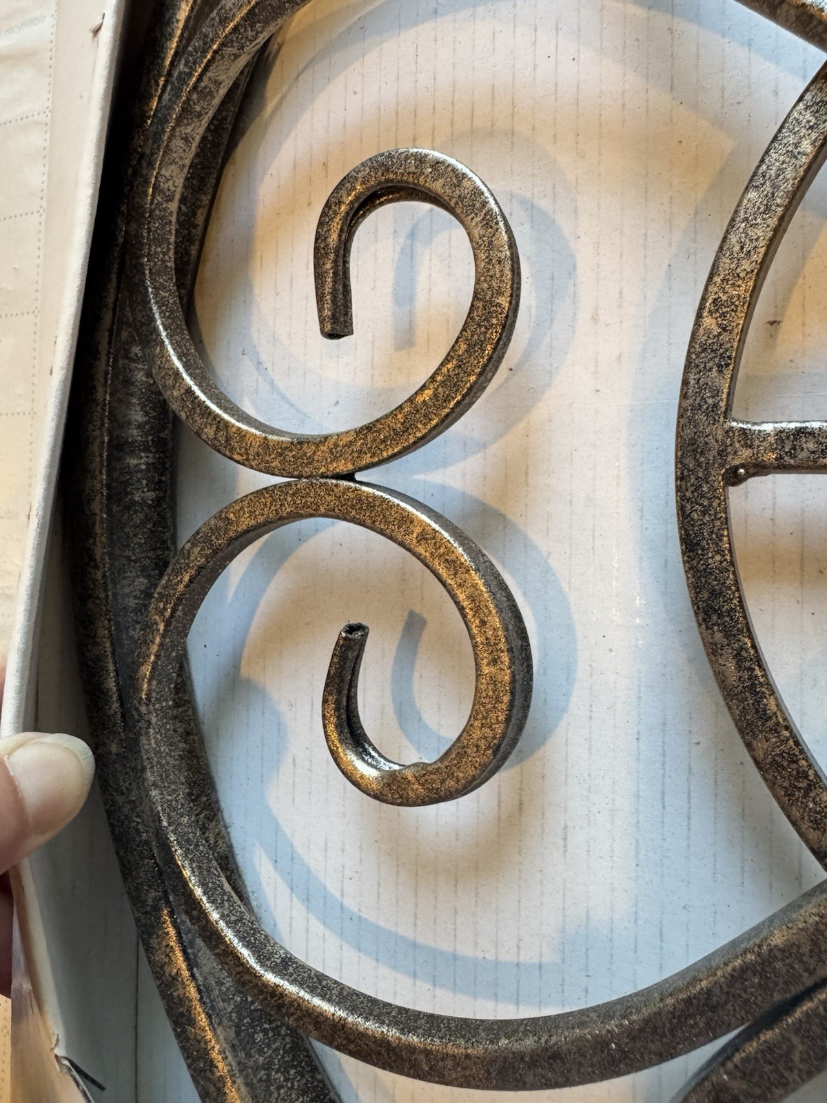 at home Traditional Metal Scrollwork Wall Plaque, Black/Gold Distressed 15″