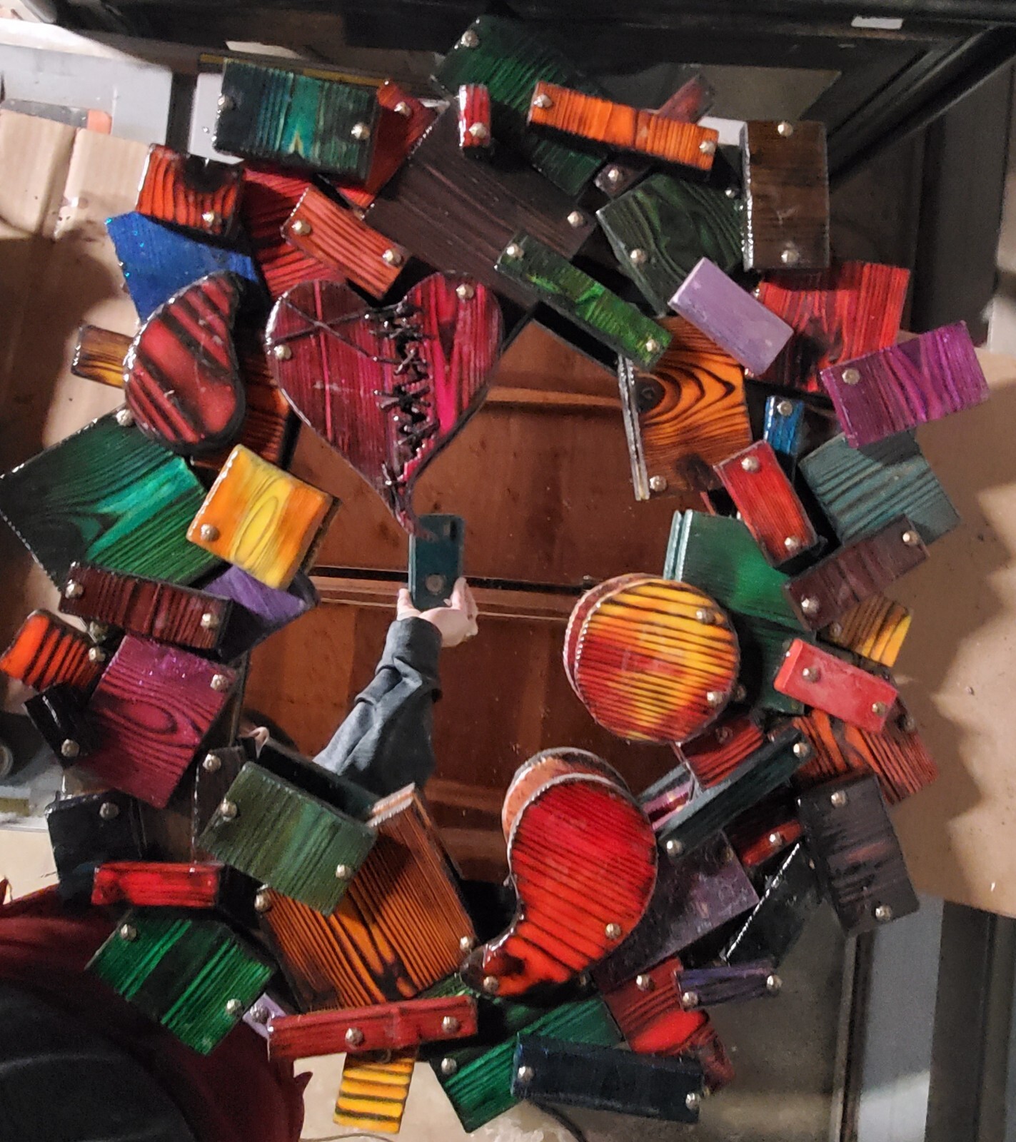 One-of-a-kind, handmade, colorful wooden wall art with mirror.