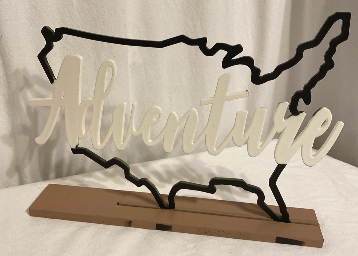 ADVENTURE word spell out in USA nationwide sign standing freeform tabletop desk